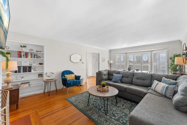 a living room with furniture rug and window