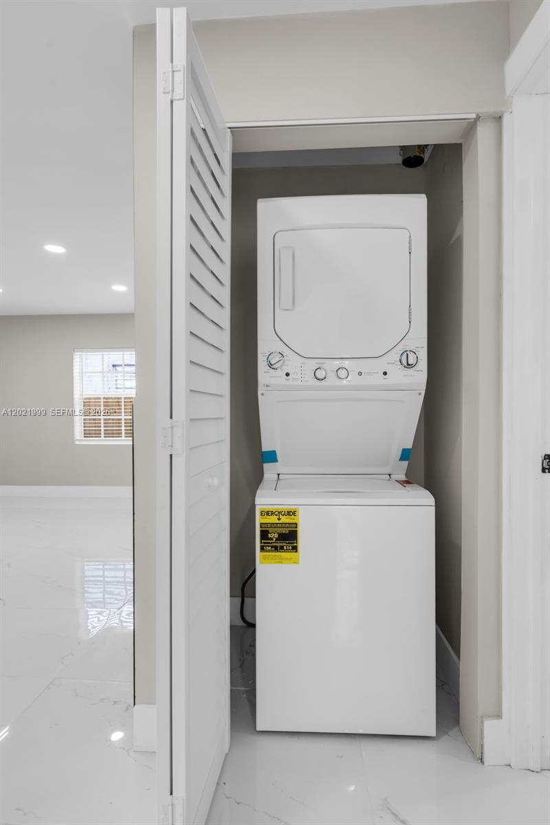 1660 West 26th Street Riviera Beach, FL 33404 - Photo 20 of 28 a utility room with dryer and washer