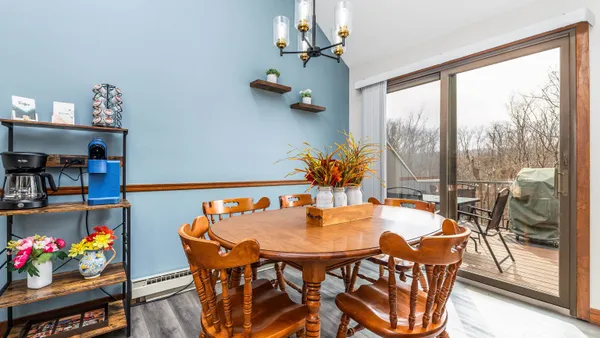 a bedroom with a large bed and a large window