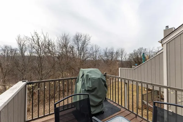 a bedroom with a bed and a night stand