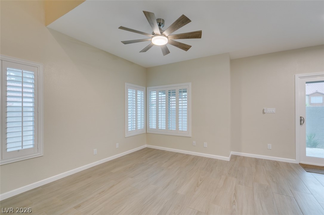 540 Sutters Mill Road Henderson, NV 89014 - Photo 12 of 46 Bright and airy room with elegant wood flooring and a refreshing ceiling fan.