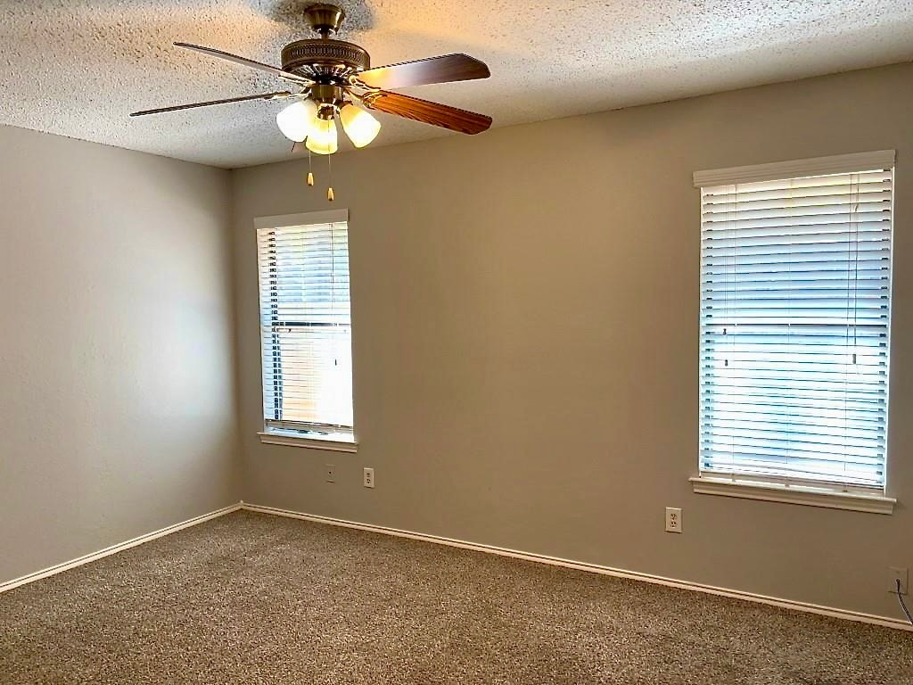 7809 Topawa Cove, Unit B Austin, TX 78729 - Photo 14 of 14 a view of an empty room with a window