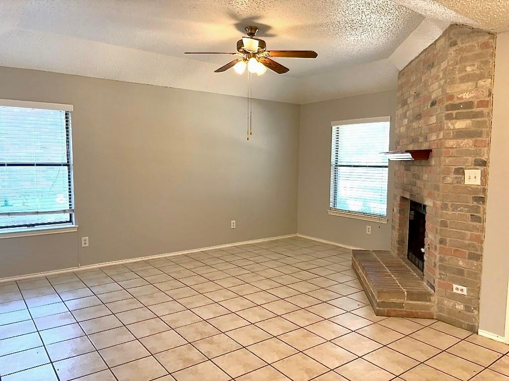 7809 Topawa Cove, Unit B Austin, TX 78729 - Photo 2 of 14 a view of an empty room and window