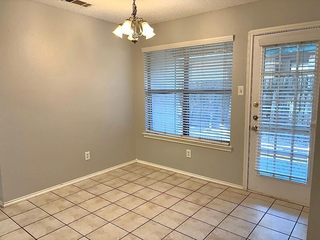 7809 Topawa Cove, Unit B Austin, TX 78729 - Photo 4 of 14 a view of a livingroom with a chandelier