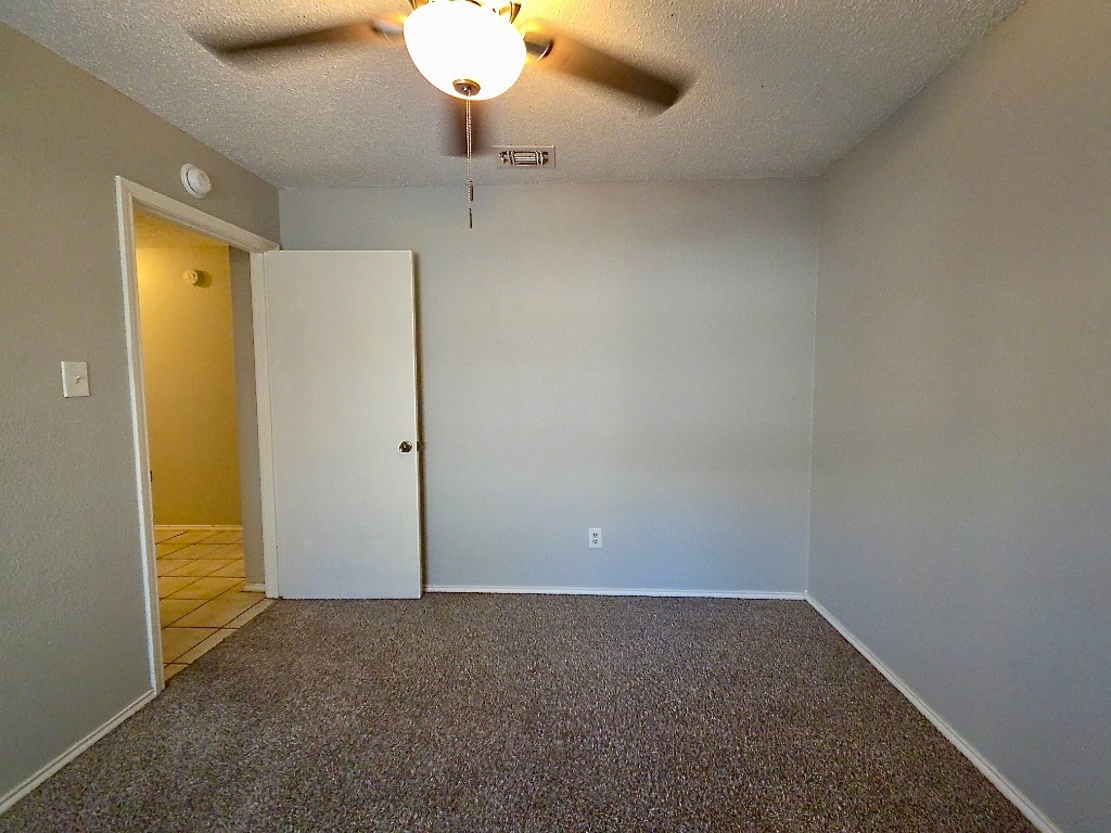 7809 Topawa Cove, Unit B Austin, TX 78729 - Photo 9 of 14 an empty room with a empty space