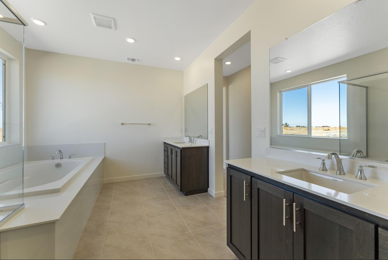 5956 Big Sky Drive Fairfield, CA 94533 - Photo 18 of 22 a spacious bathroom with a tub sink shower and mirror