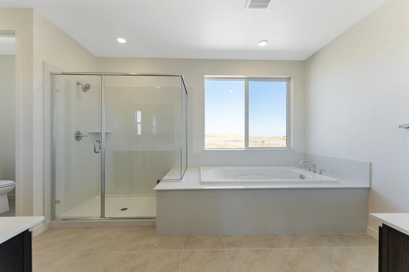 5956 Big Sky Drive Fairfield, CA 94533 - Photo 19 of 22 a bathroom with a bathtub and shower