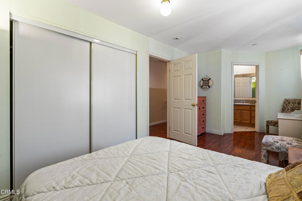 907 West Mission Road, Unit B Alhambra, CA 91801 - Photo 14 of 27 a bedroom with a large bed and wooden floor