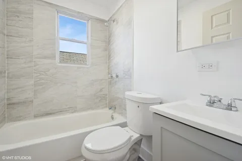 a bathroom with a sink toilet and bathtub