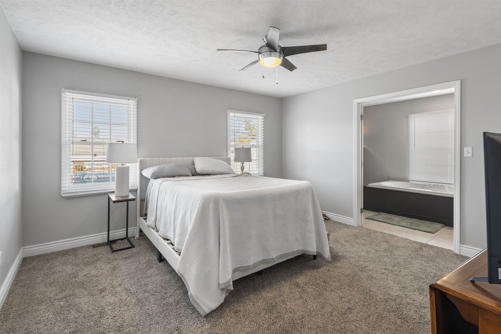 3005 Hickory Ridge Drive, Unit 3005 Herrin, IL 62948 - Photo 15 of 23 a bedroom with a bed and a chandelier