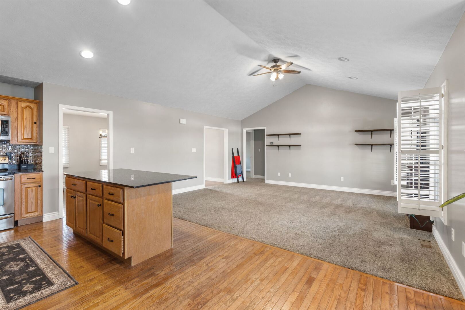 3005 Hickory Ridge Drive, Unit 3005 Herrin, IL 62948 - Photo 6 of 23 a kitchen with stainless steel appliances granite countertop a stove and a wooden cabinets