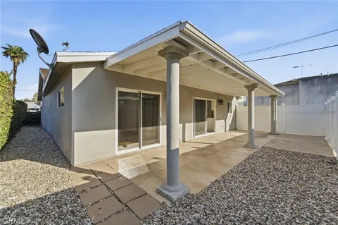 a front view of a house with a yard and a garage