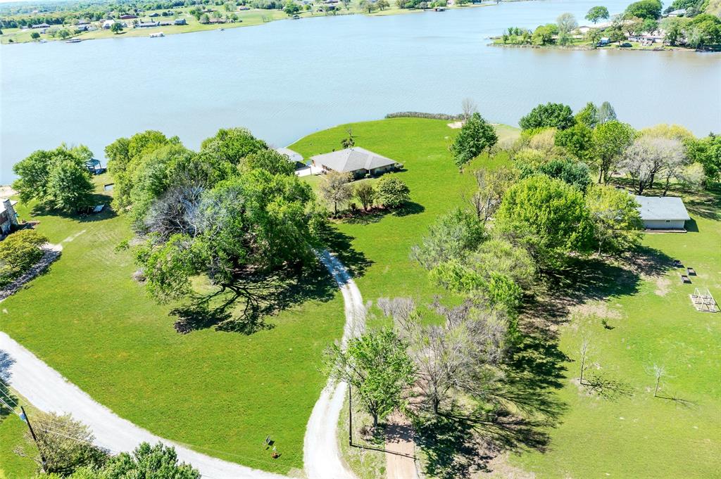 2206 Beavers Point Bonham, TX 75418 - Photo 1 of 1 a view of a garden with a lake