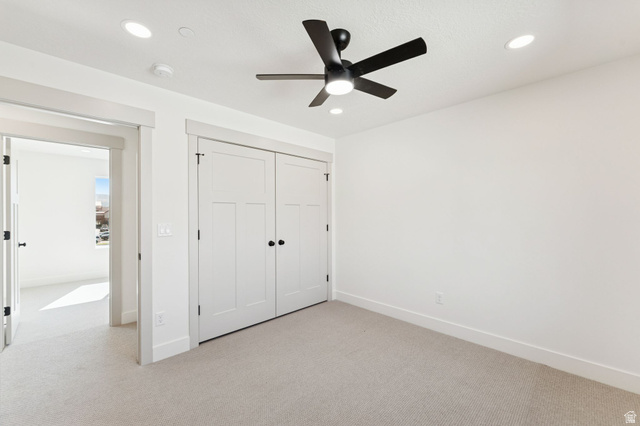 254 North Main Street Bountiful, UT 84010 - Photo 16 of 45 Unfurnished bedroom featuring light colored carpet, recessed lighting, a closet, and ceiling fan