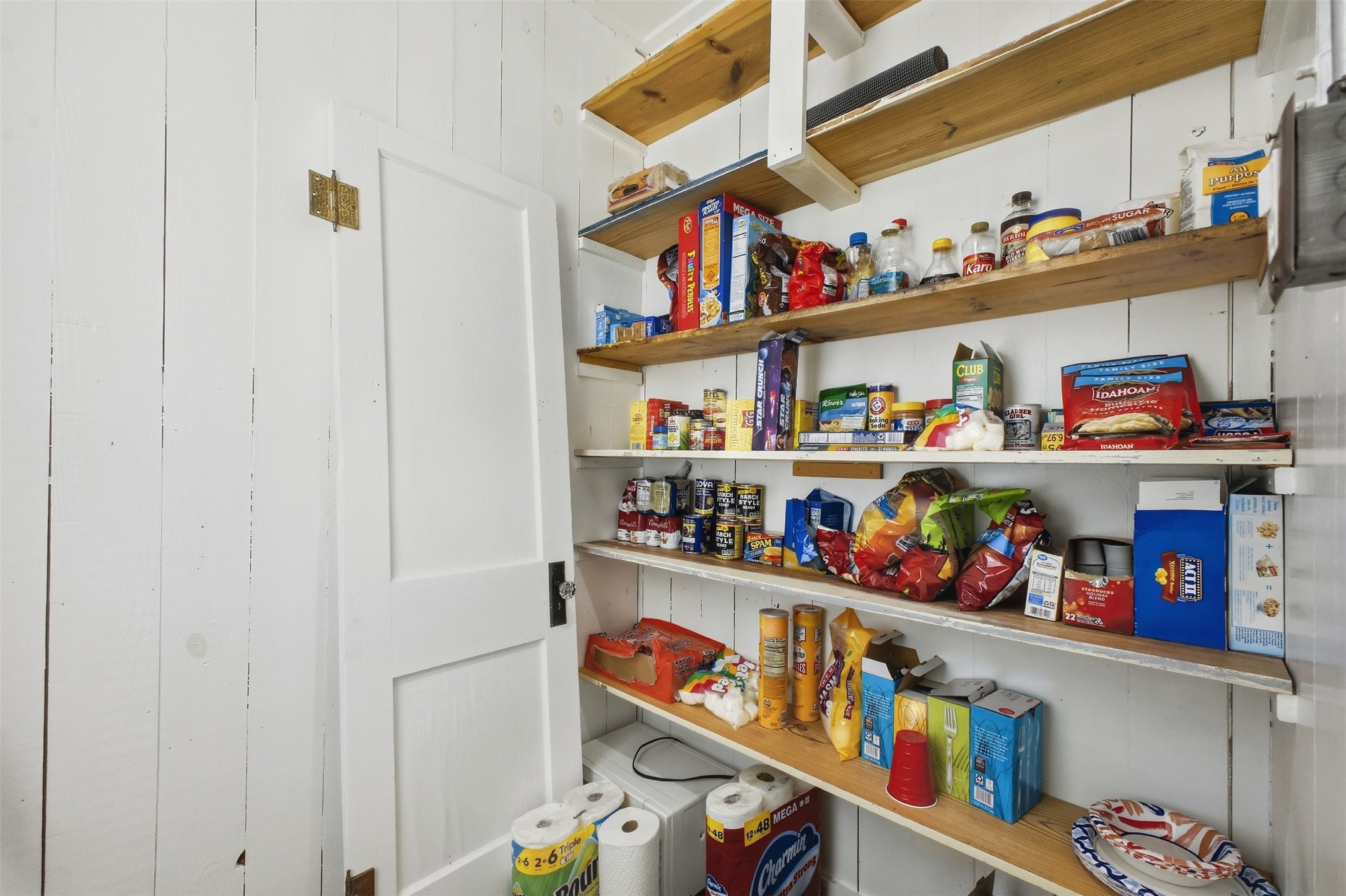 1903 Tigerpoint Road Brenham, TX 77833 - Photo 9 of 27 a store room with lots of clutter and storage