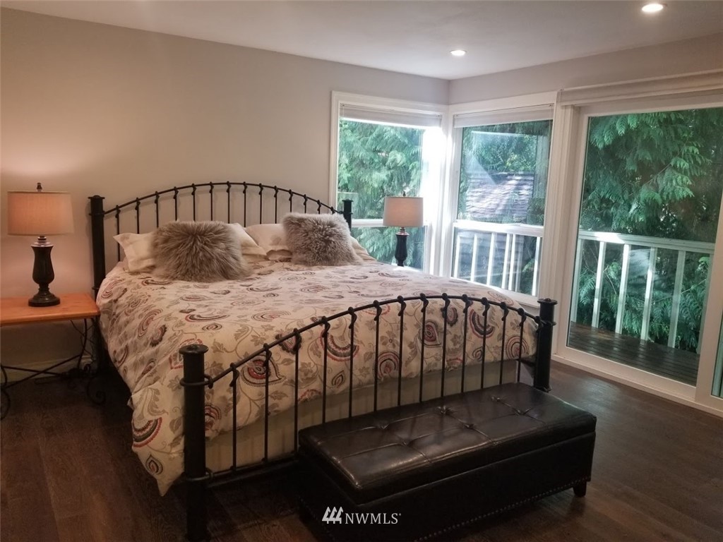 17023 154th Place Southeast Renton, WA 98058 - Photo 6 of 24 a bedroom with a bed next to a large window