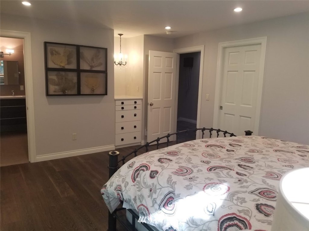 17023 154th Place Southeast Renton, WA 98058 - Photo 7 of 24 a bedroom with a bed and a mirror
