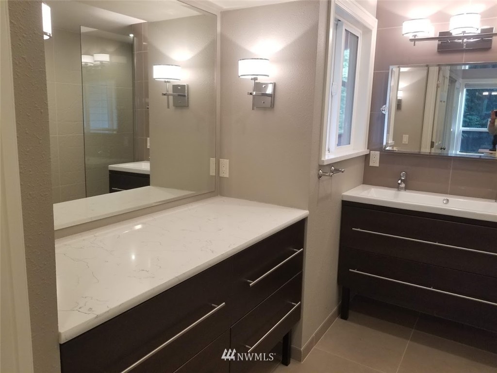 17023 154th Place Southeast Renton, WA 98058 - Photo 8 of 24 a bathroom with a sink and a mirror