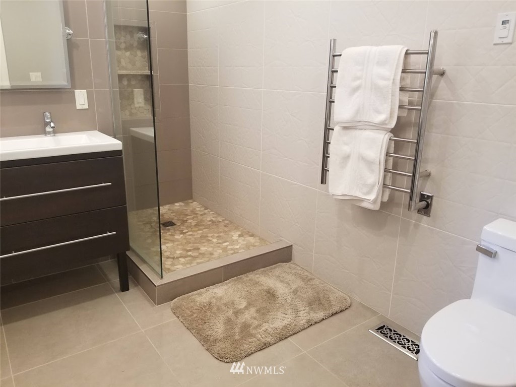 17023 154th Place Southeast Renton, WA 98058 - Photo 9 of 24 a bathroom with a sink toilet and shower