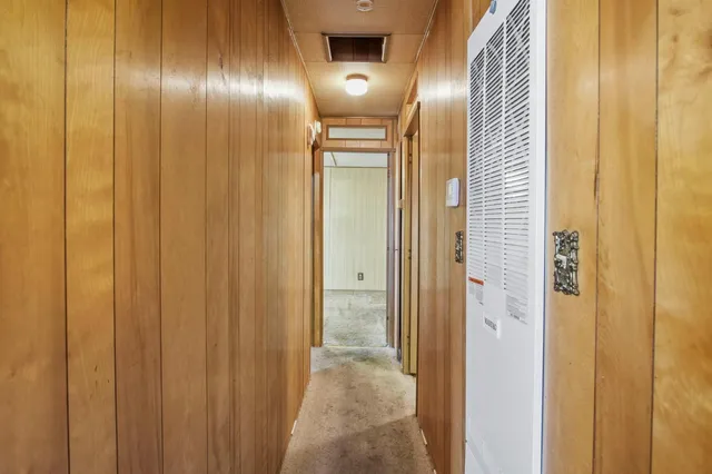 a bathroom with a granite countertop sink and a bathtub