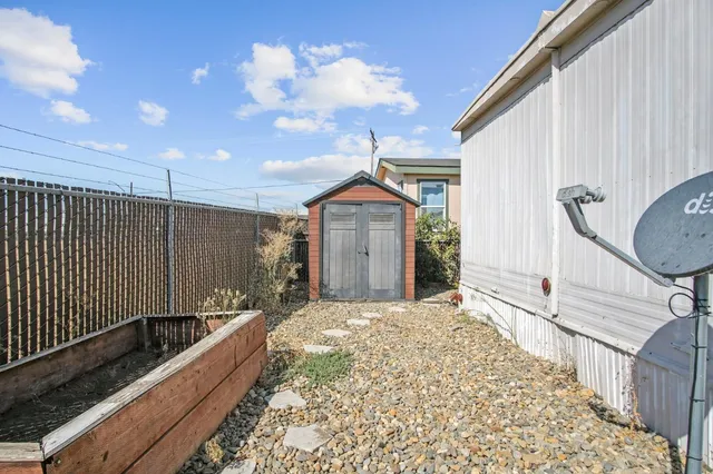 a view of multiple houses with outdoor space