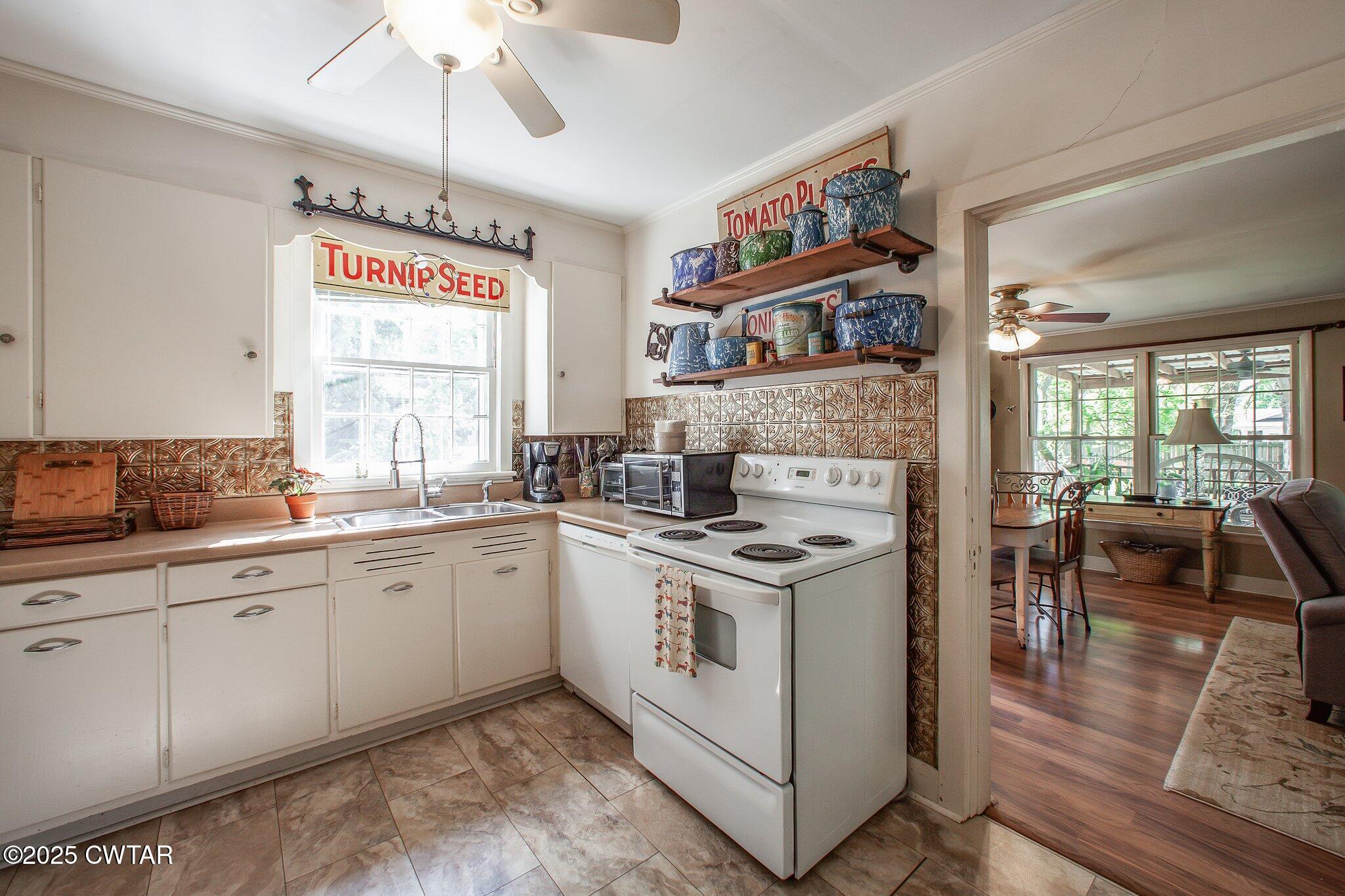 302 Walnut Street Jackson, TN 38301 - Photo 13 of 38 a kitchen with a stove and cabinets