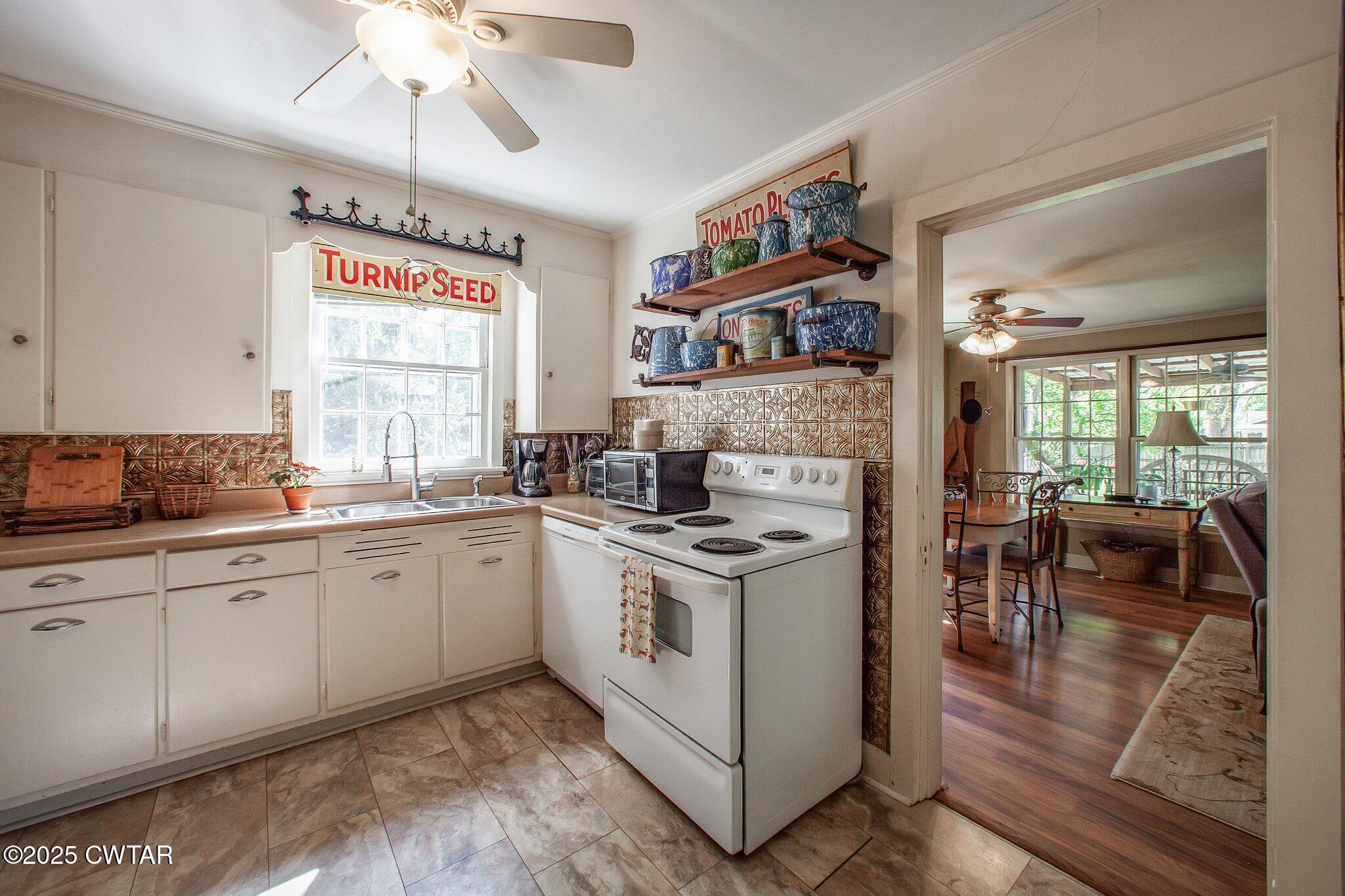 302 Walnut Street Jackson, TN 38301 - Photo 15 of 38 a kitchen with stainless steel appliances granite countertop a stove and cabinets