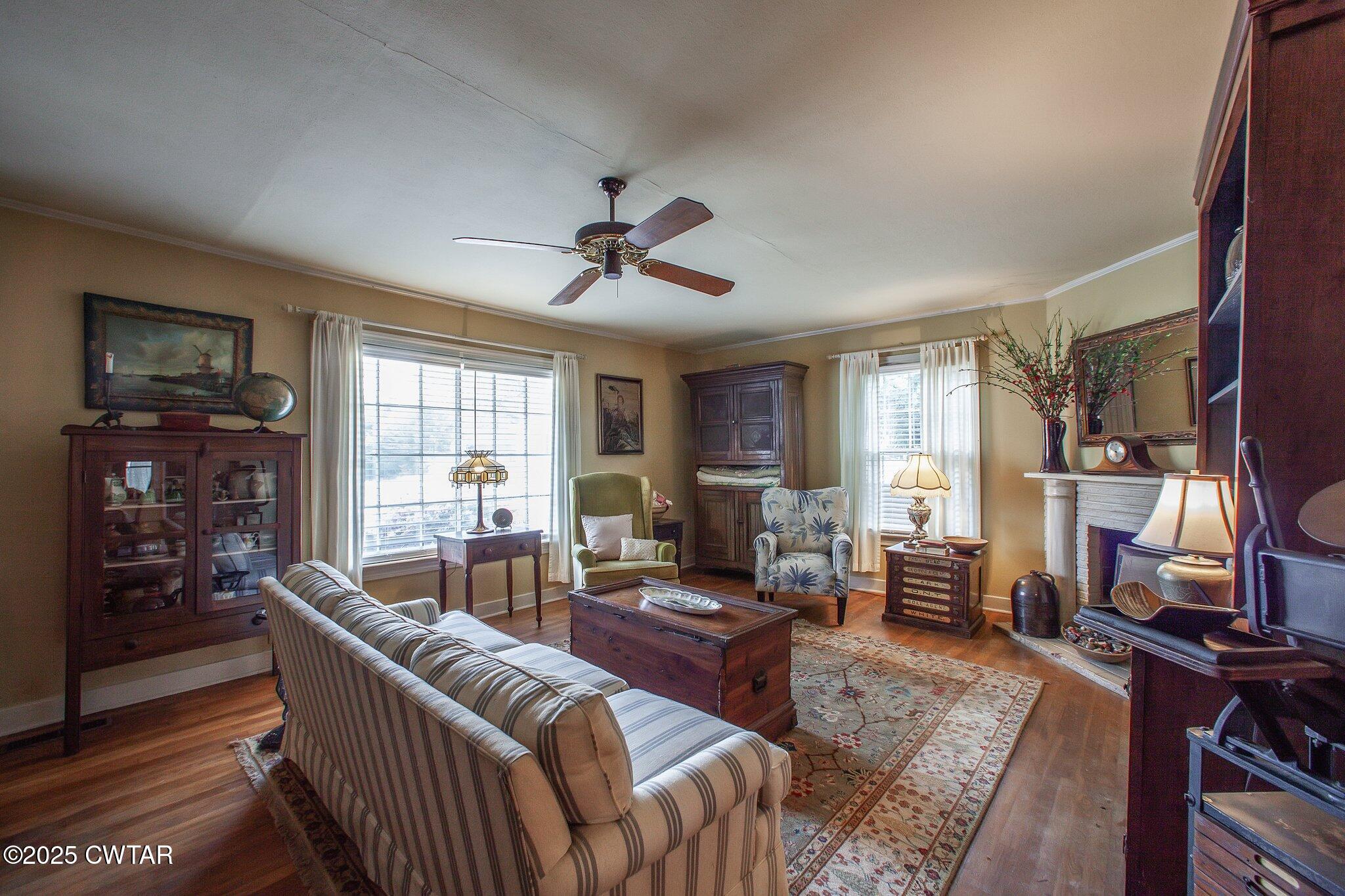 302 Walnut Street Jackson, TN 38301 - Photo 25 of 38 a living room with furniture fireplace and a window