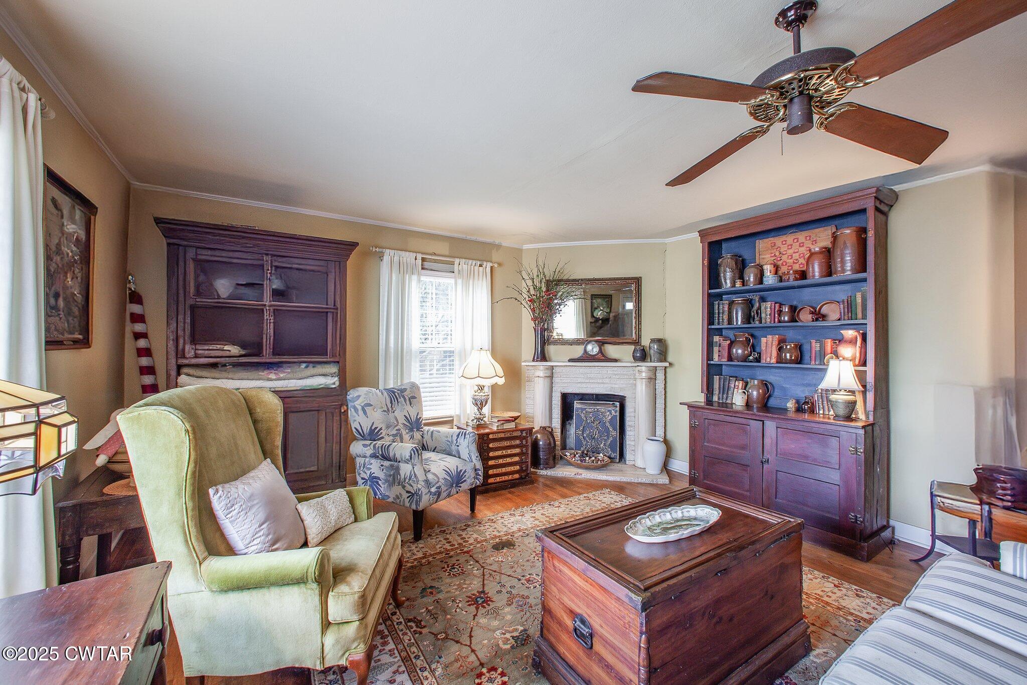 302 Walnut Street Jackson, TN 38301 - Photo 26 of 38 a living room with furniture a fireplace and a window