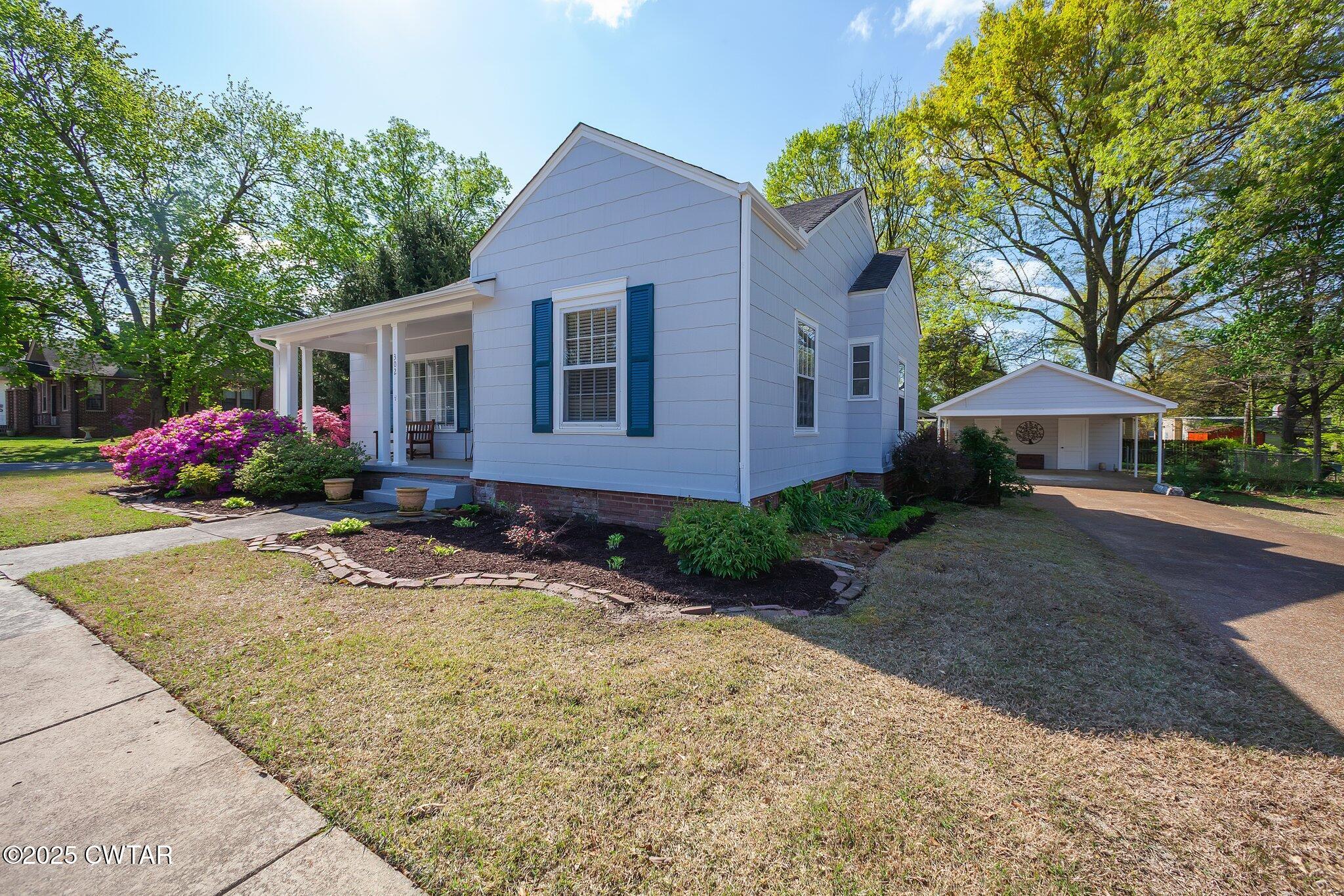302 Walnut Street Jackson, TN 38301 - Photo 3 of 38 a front view of house with yard and trees