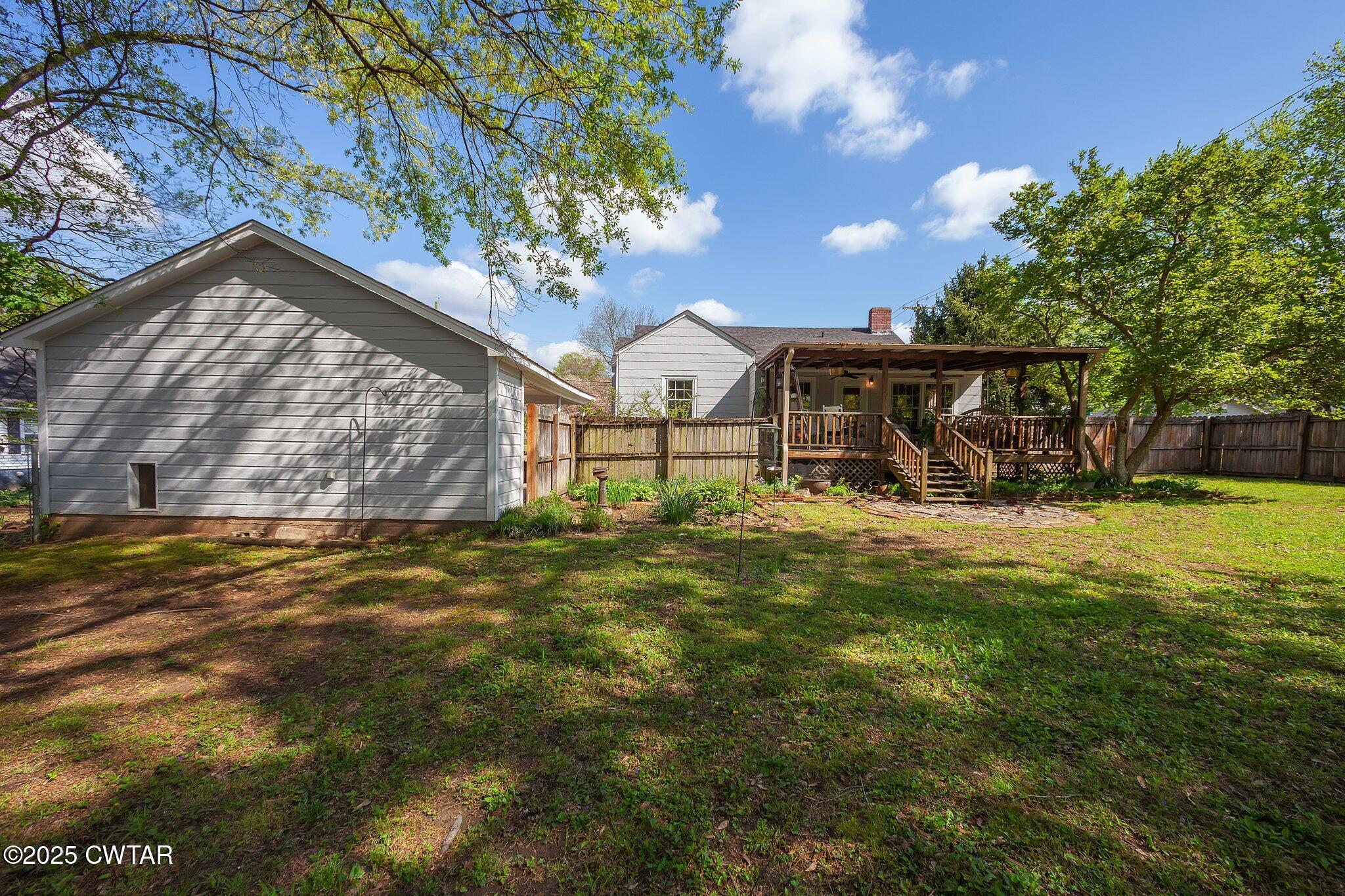 302 Walnut Street Jackson, TN 38301 - Photo 34 of 38 a view of a house with a yard