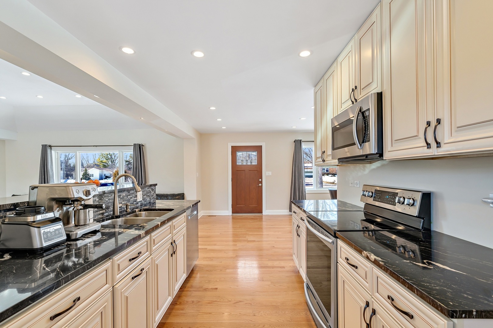 11 Pine Tree Road Northbrook, IL 60062 - Photo 8 of 27 a large kitchen with stainless steel appliances granite countertop a stove and a sink