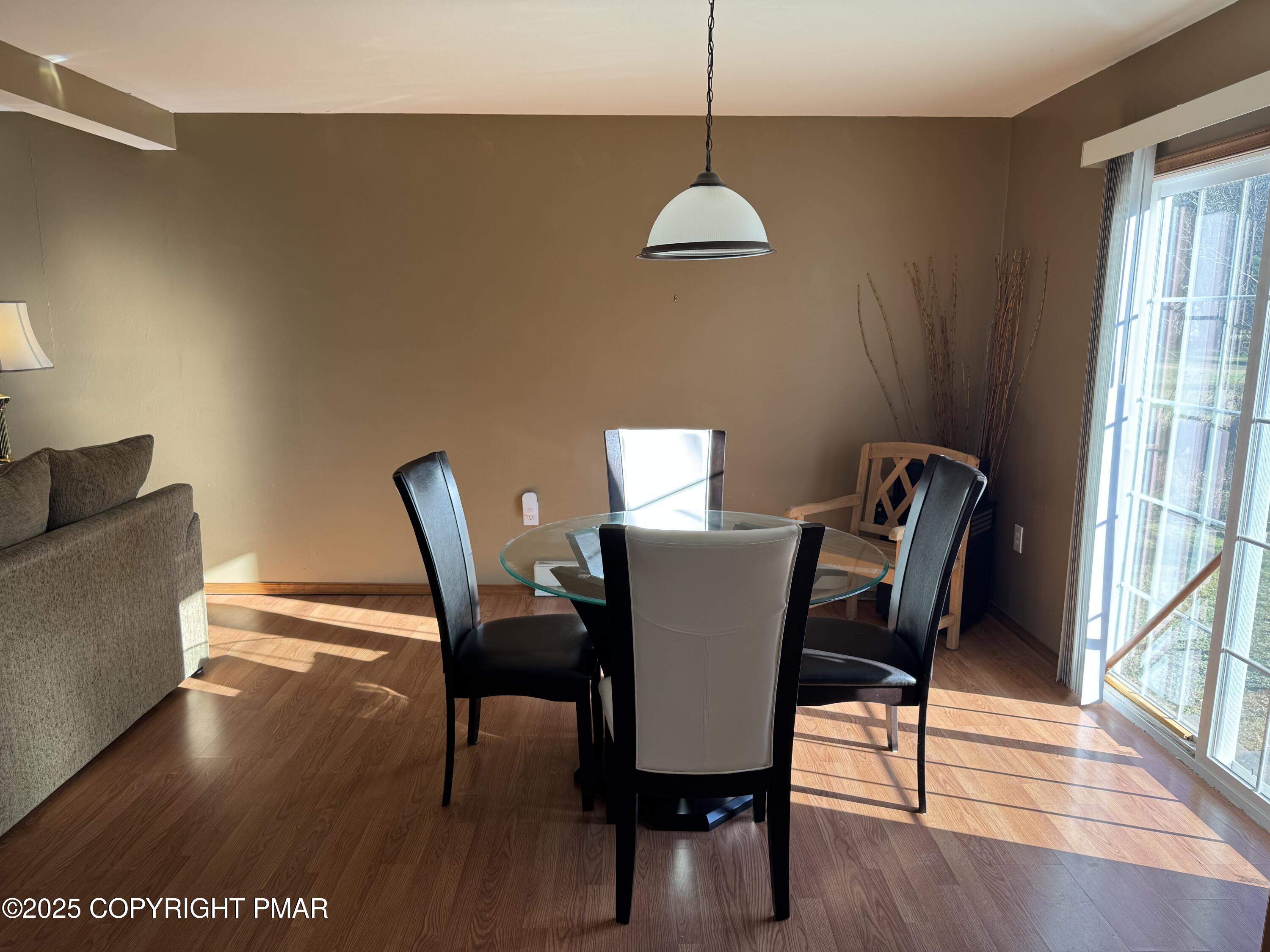 152 Bull Run Long Pond, PA 18334 - Photo 12 of 58 a view of a dining room with furniture window and wooden floor