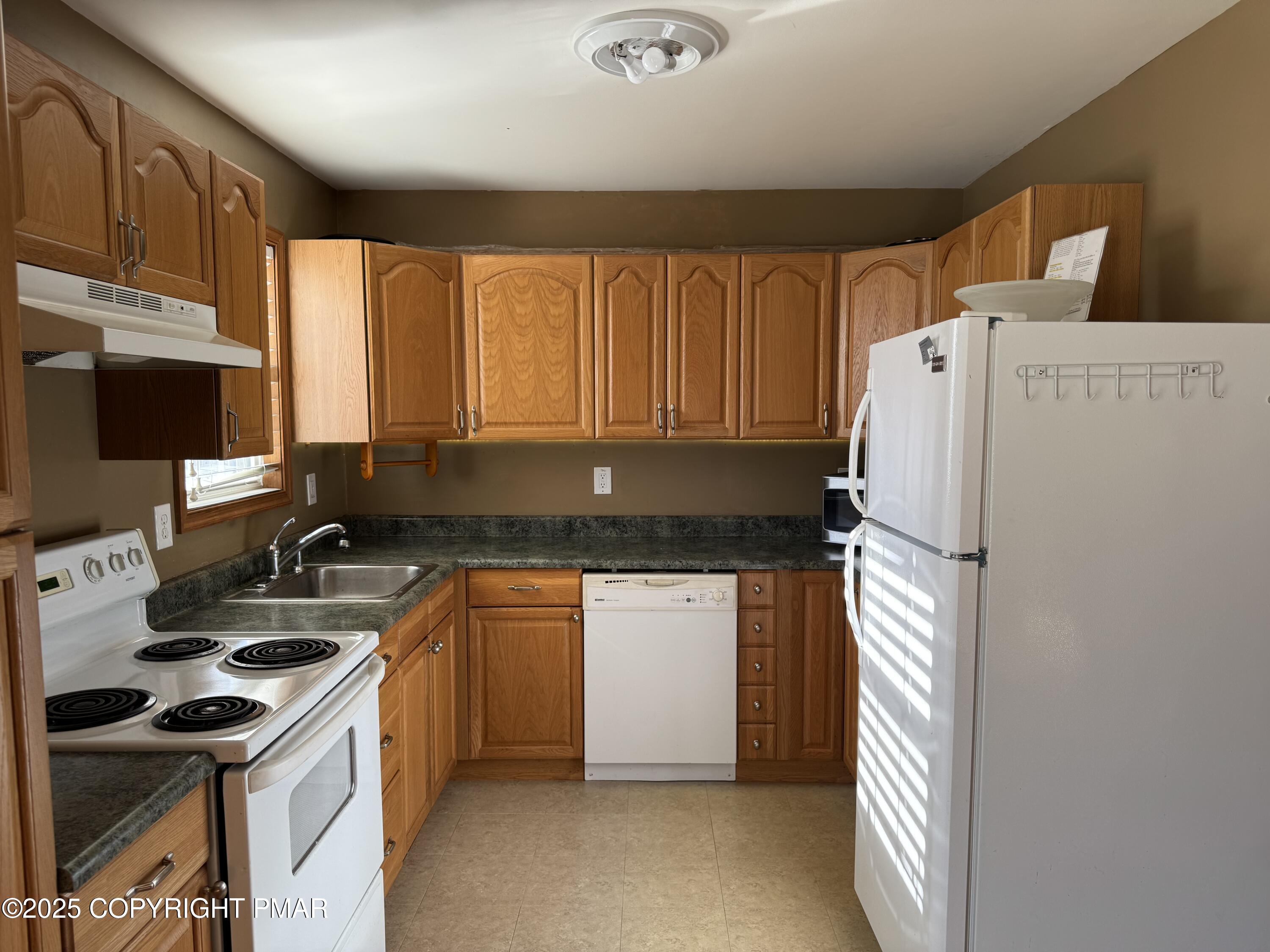 152 Bull Run Long Pond, PA 18334 - Photo 21 of 58 a kitchen with a refrigerator stove and sink