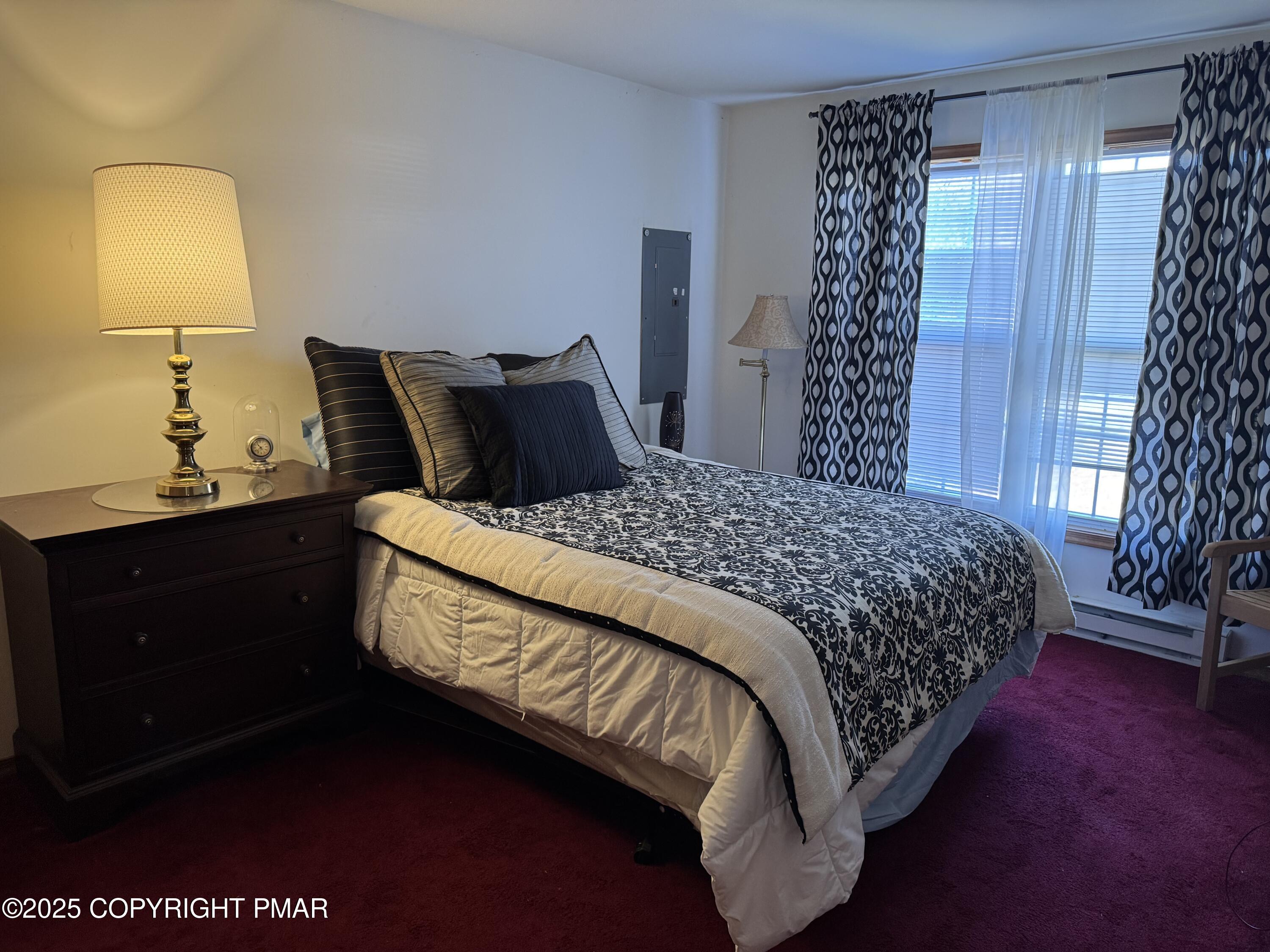 152 Bull Run Long Pond, PA 18334 - Photo 26 of 58 a large bed sitting in a bedroom next to a window