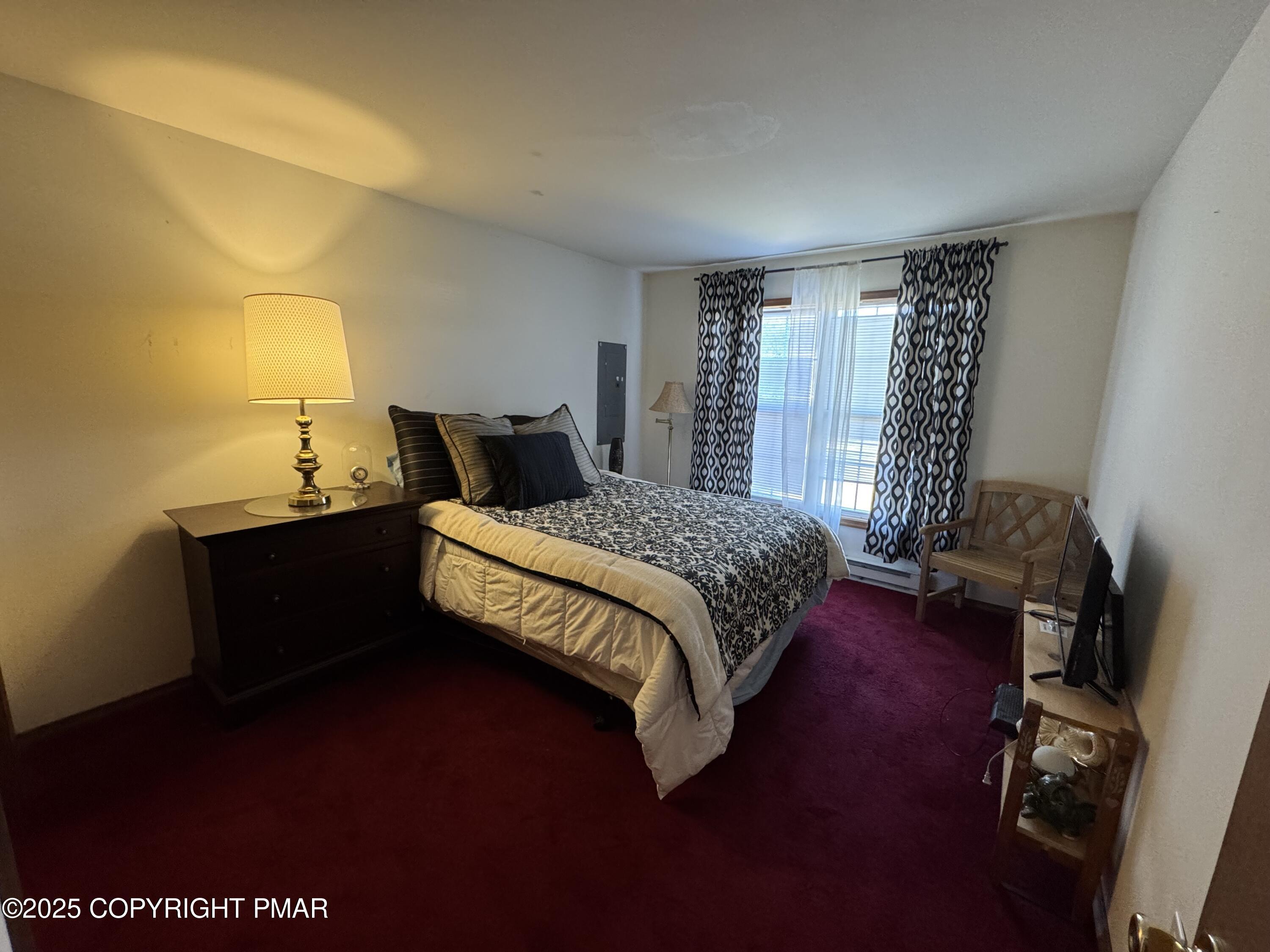 152 Bull Run Long Pond, PA 18334 - Photo 28 of 58 a bedroom with a bed and wooden floor