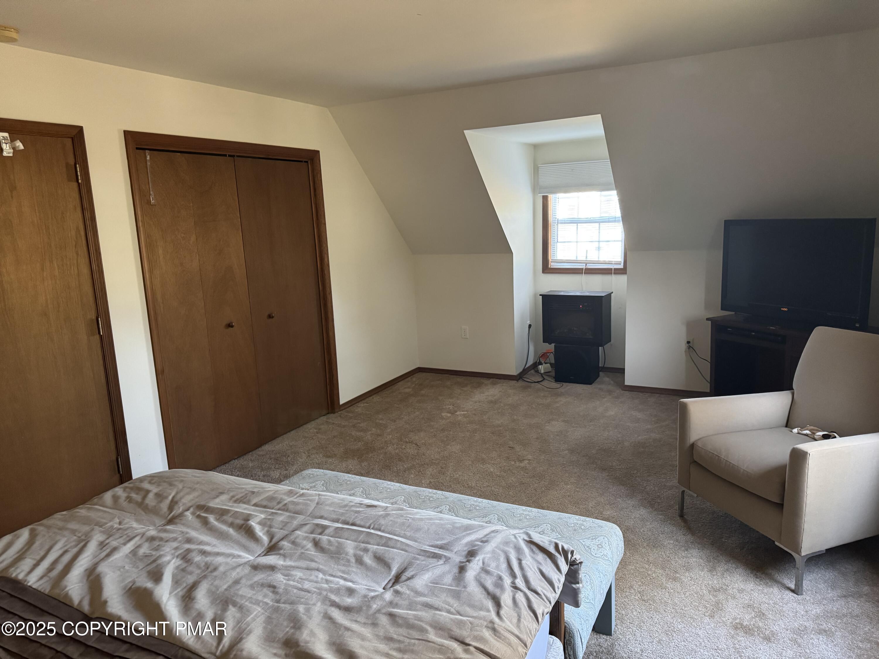 152 Bull Run Long Pond, PA 18334 - Photo 32 of 58 a bedroom with a bed and a couch