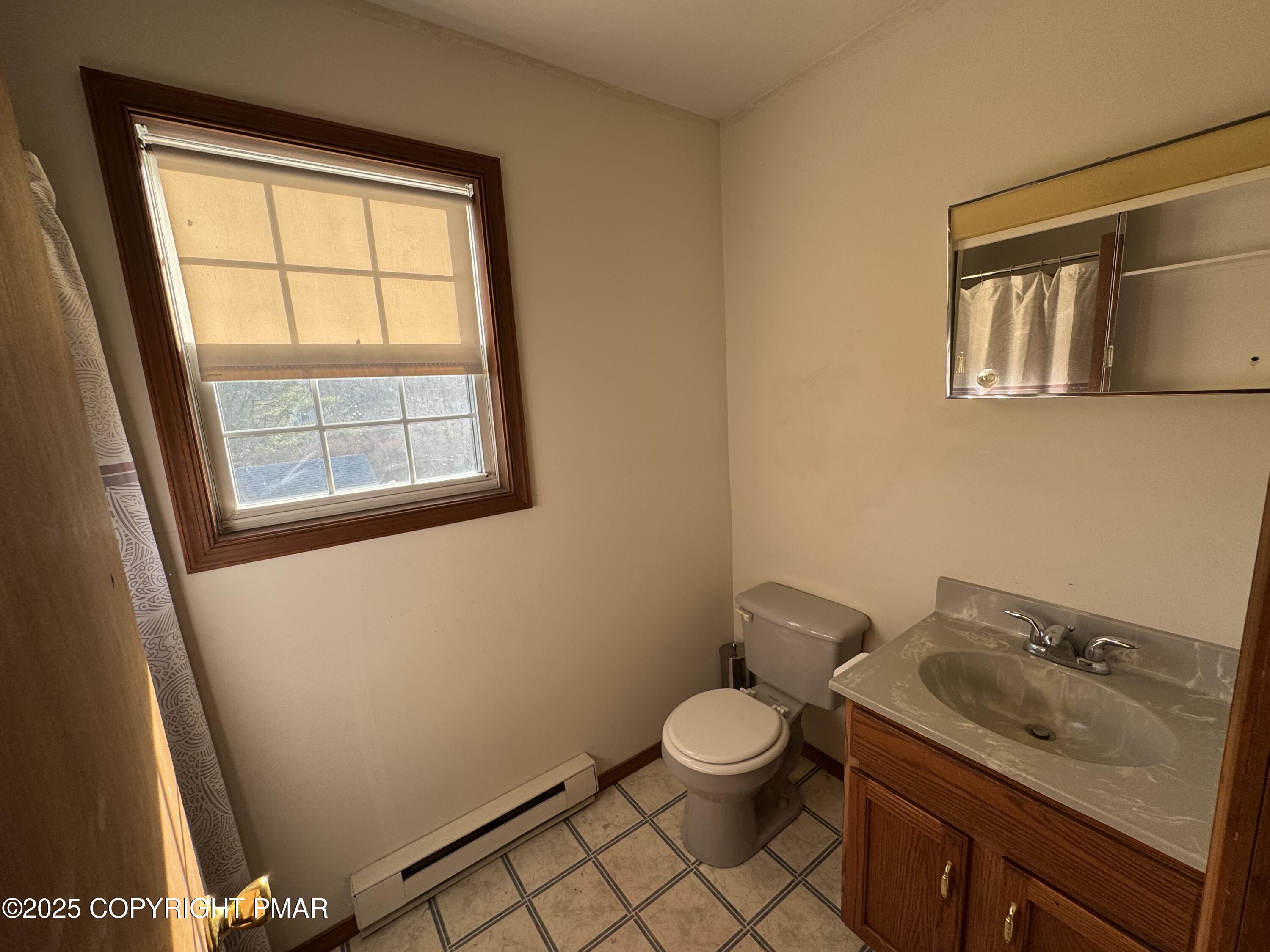 152 Bull Run Long Pond, PA 18334 - Photo 34 of 58 a bathroom with a toilet sink and mirror