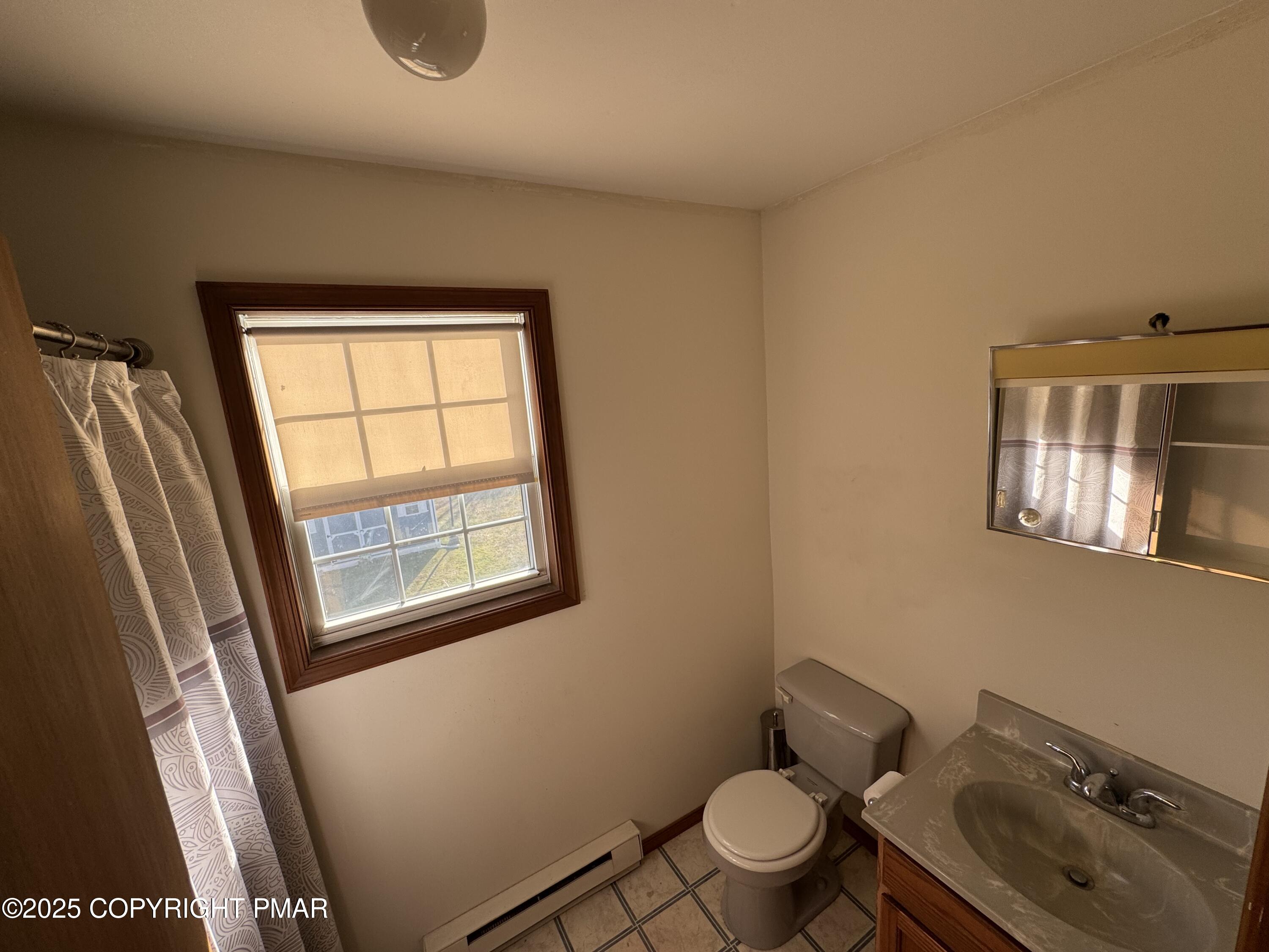 152 Bull Run Long Pond, PA 18334 - Photo 36 of 58 a bathroom with a sink toilet and window
