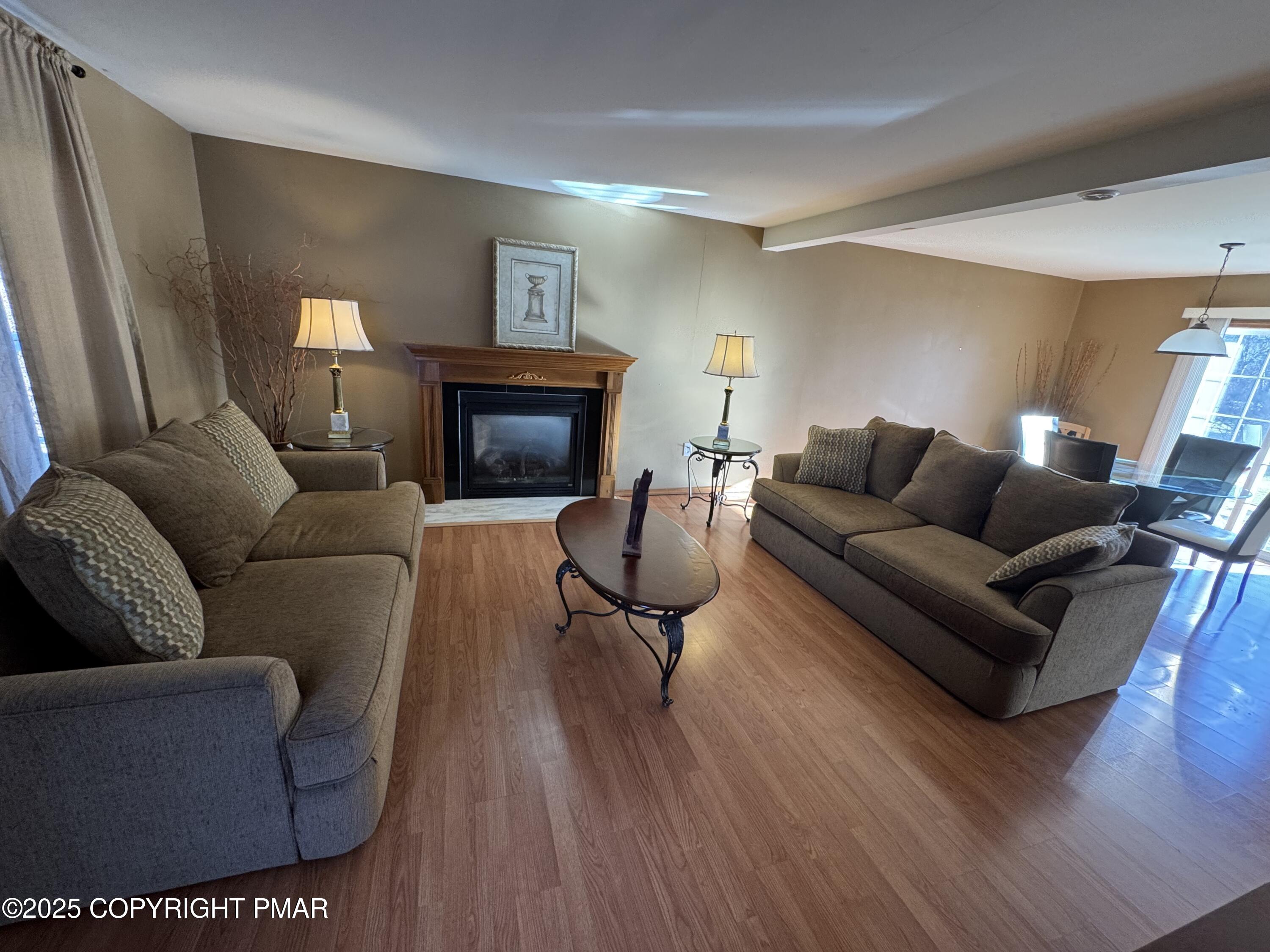 152 Bull Run Long Pond, PA 18334 - Photo 4 of 58 a living room with furniture and a fireplace
