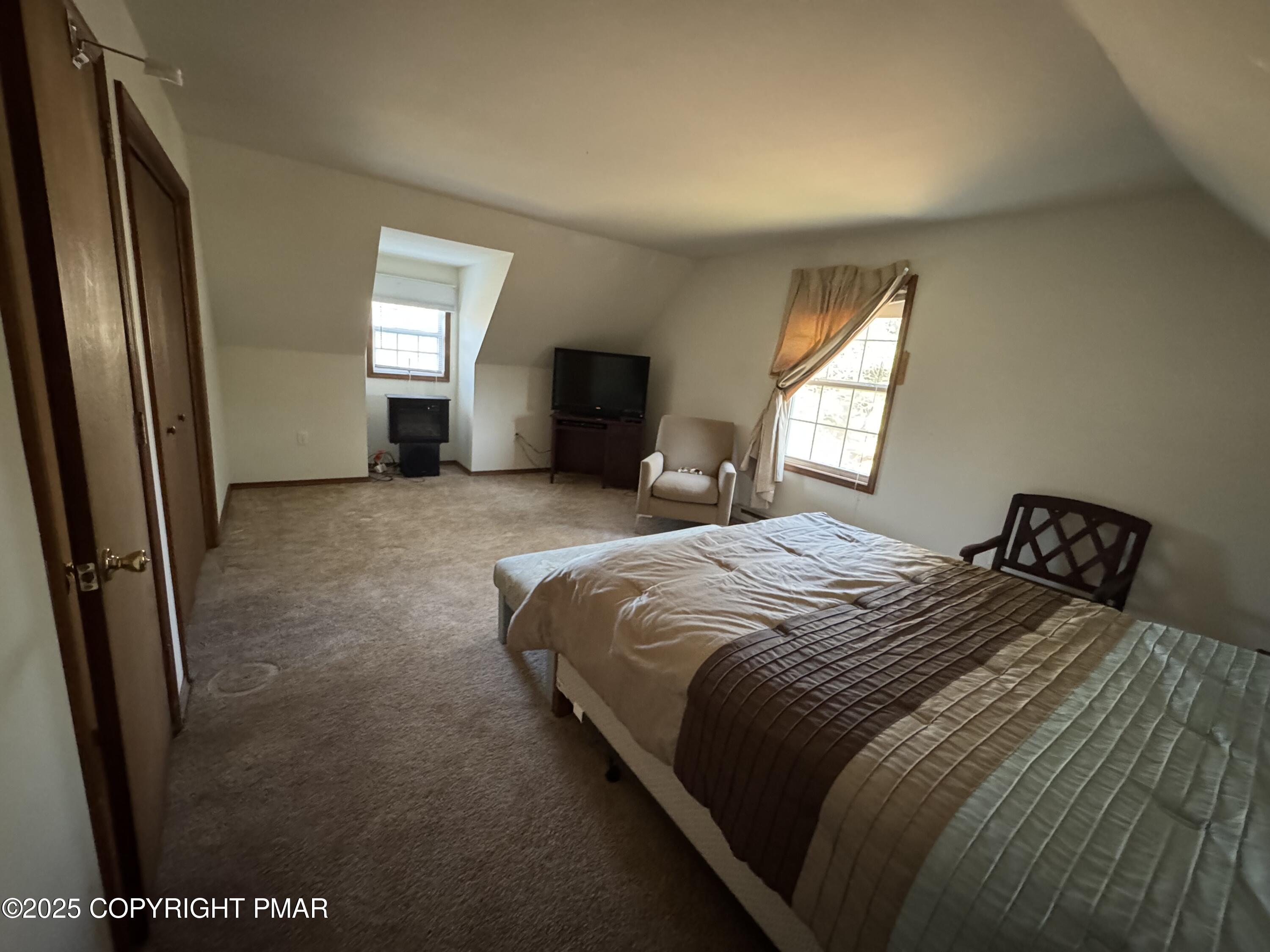 152 Bull Run Long Pond, PA 18334 - Photo 43 of 58 a bedroom with a bed and mirror