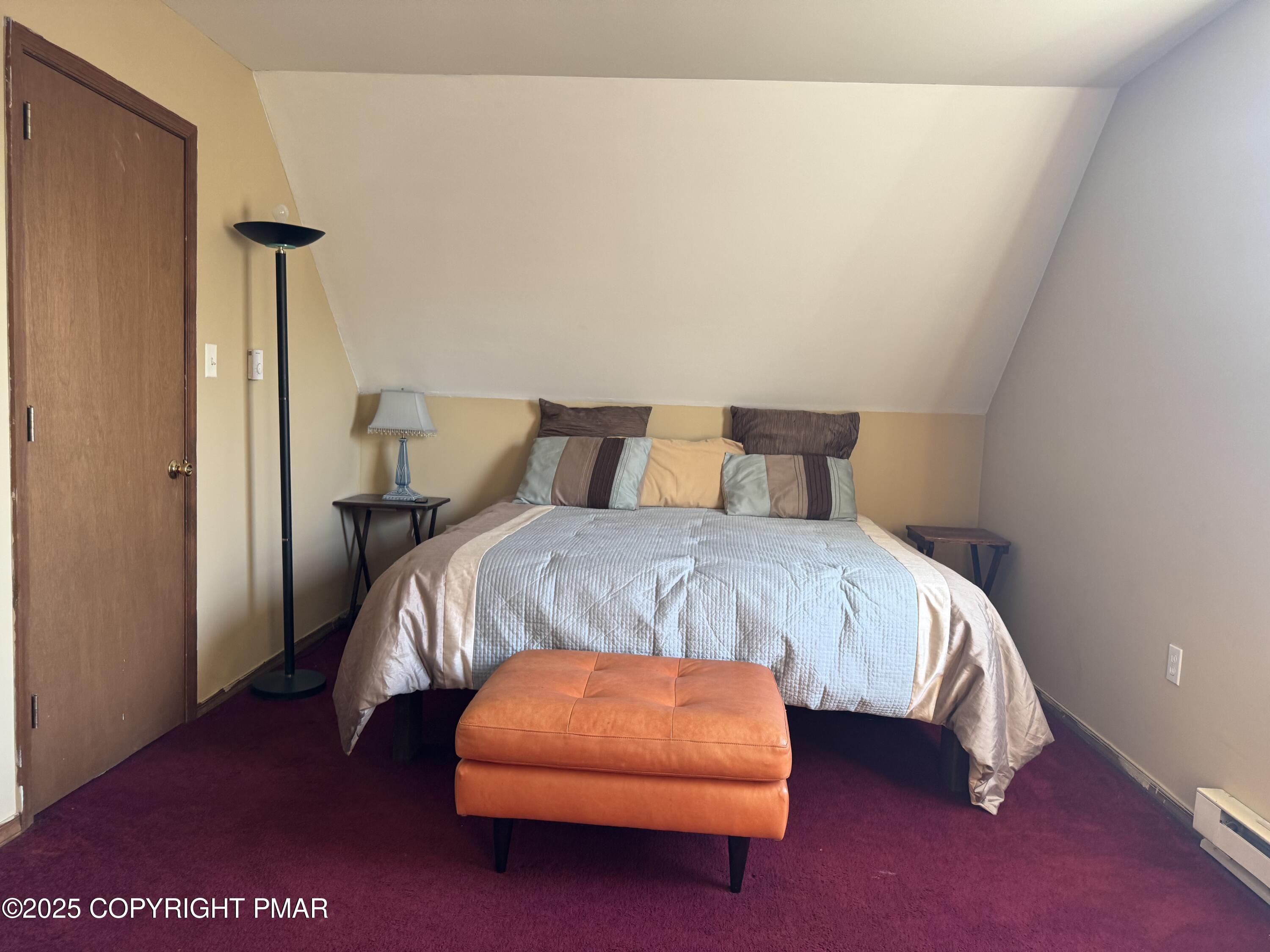 152 Bull Run Long Pond, PA 18334 - Photo 47 of 58 a bedroom with a bed lamp and a potted plant