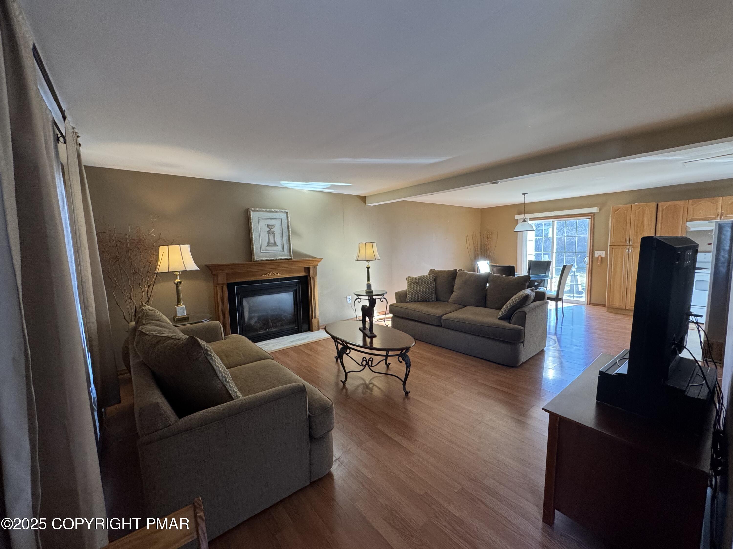 152 Bull Run Long Pond, PA 18334 - Photo 5 of 58 a living room with furniture and a fireplace