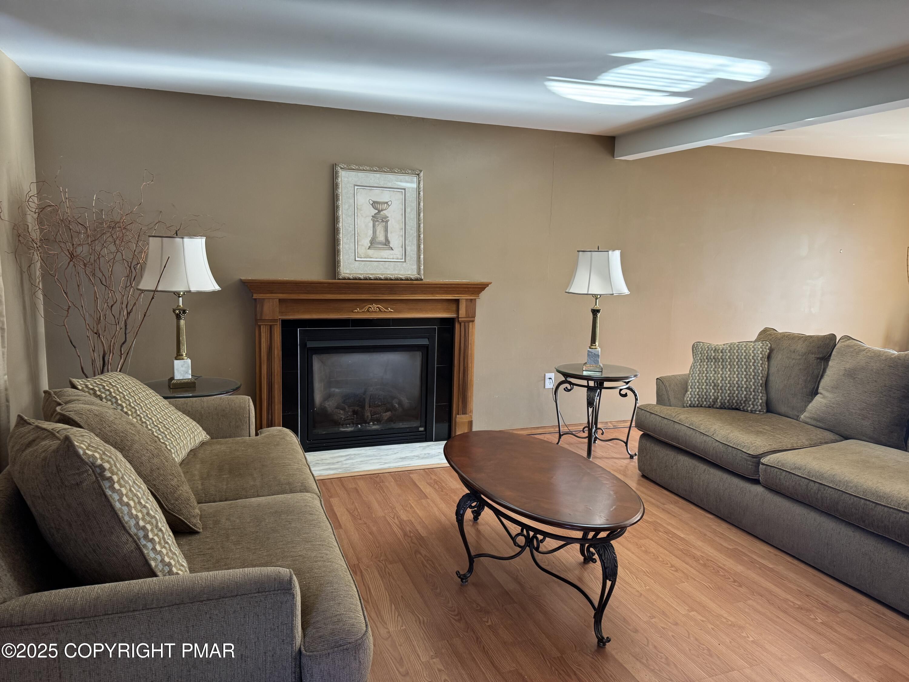 152 Bull Run Long Pond, PA 18334 - Photo 6 of 58 a living room with furniture and a fireplace