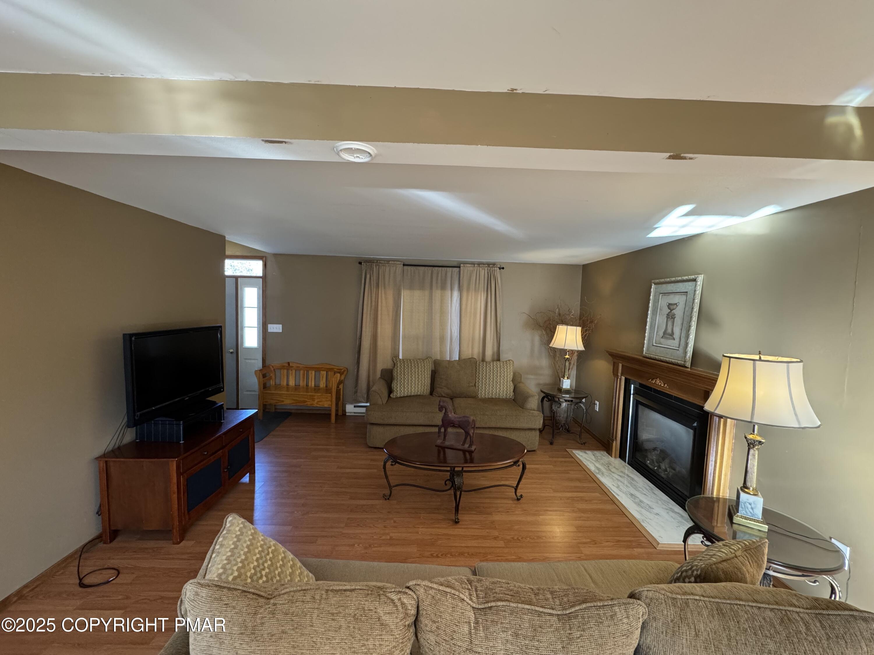 152 Bull Run Long Pond, PA 18334 - Photo 8 of 58 a living room with furniture and a flat screen tv