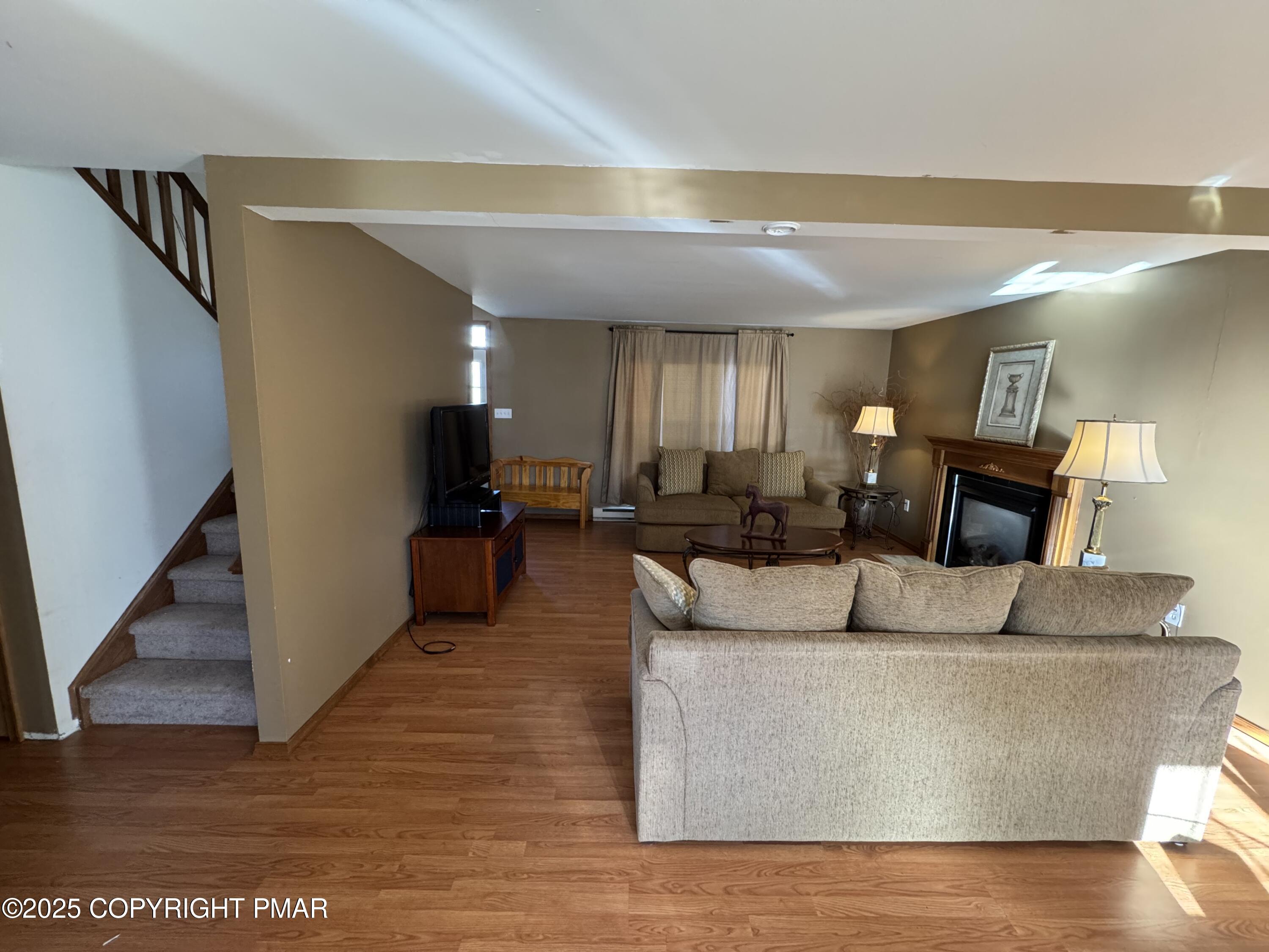 152 Bull Run Long Pond, PA 18334 - Photo 9 of 58 a living room with furniture and a wooden floor