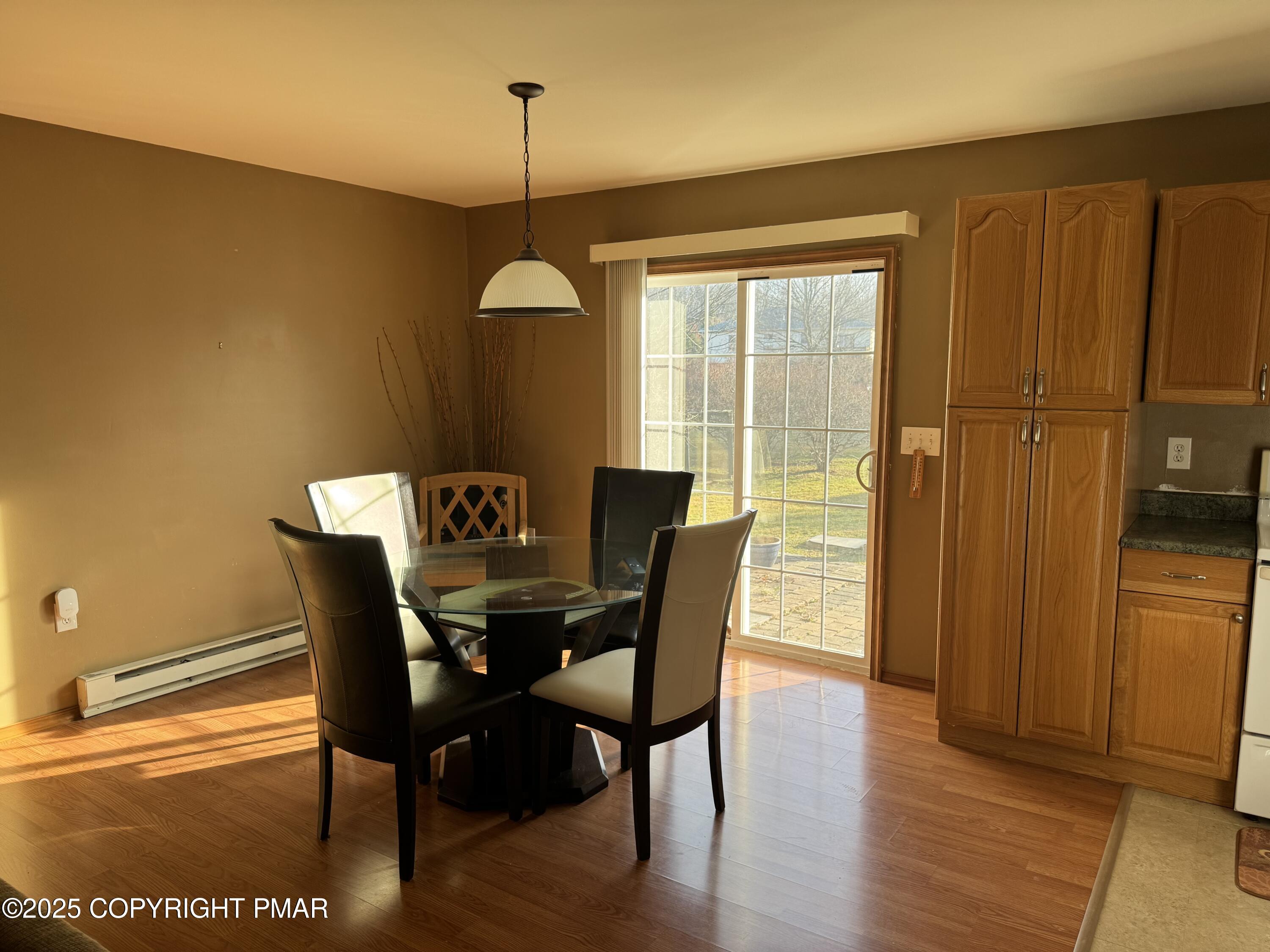 152 Bull Run Long Pond, PA 18334 - Photo 10 of 58 a view of a dining room with furniture window and wooden floor