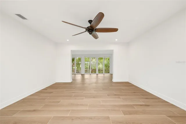 a view of an empty room with a window