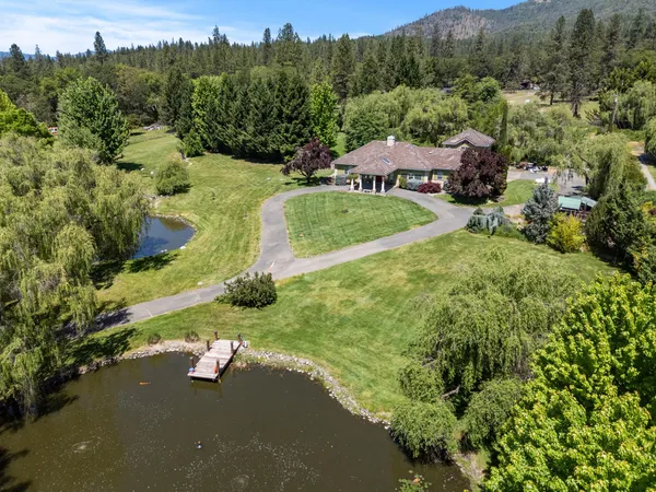 an aerial view of a house with mountain view