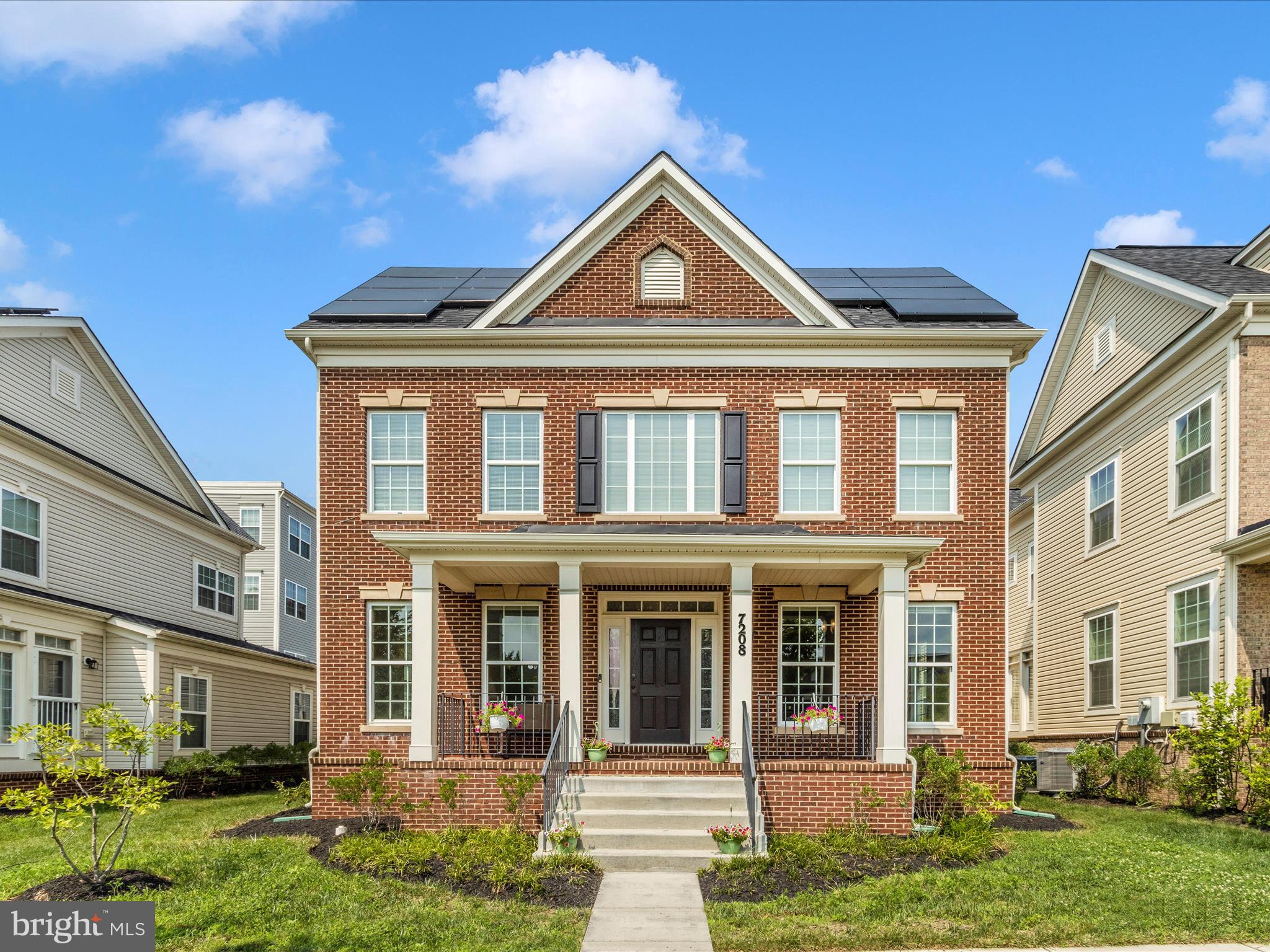7208 Maisson Ridge Circle Beltsville, MD 20705 - Photo 1 of 53 a front view of a house with a yard